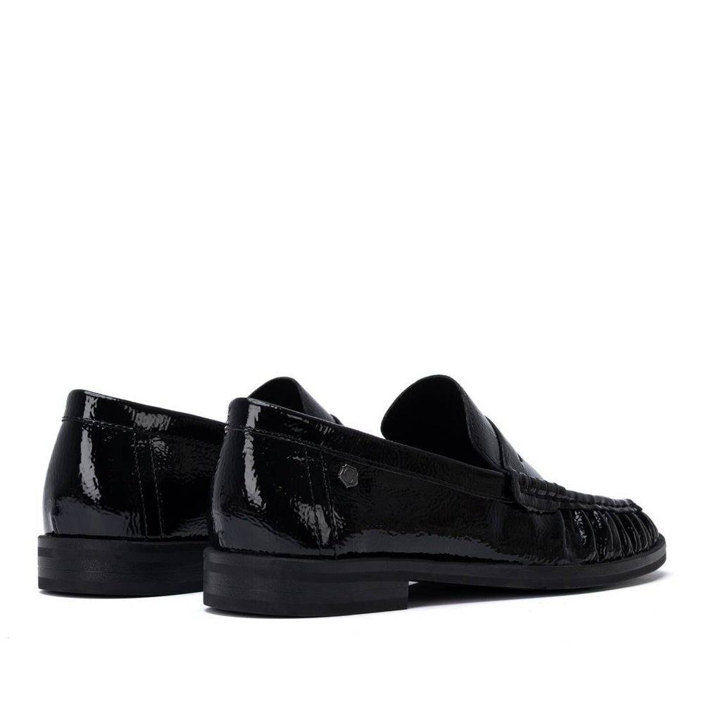 ShoeShop Carmela black patent leather loafers with a decorative front detail and durable rubber sole