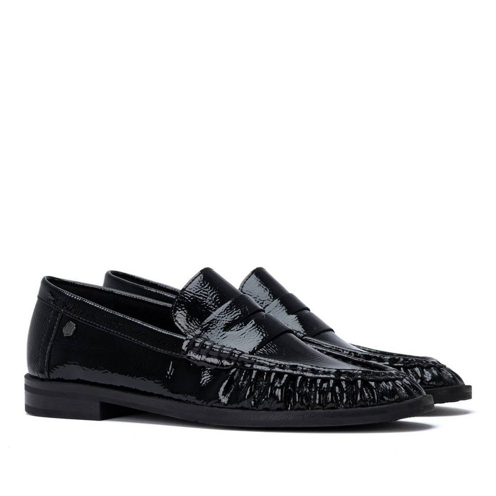 ShoeShop Carmela black patent leather loafers with decorative stitching and a durable rubber sole