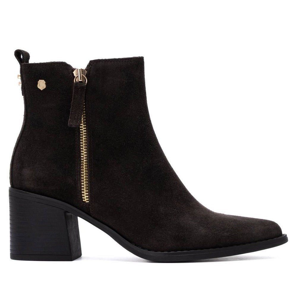 ShoeShop Carmela black suede ankle boots with side zipper, block heel, and pull tab on a white background
