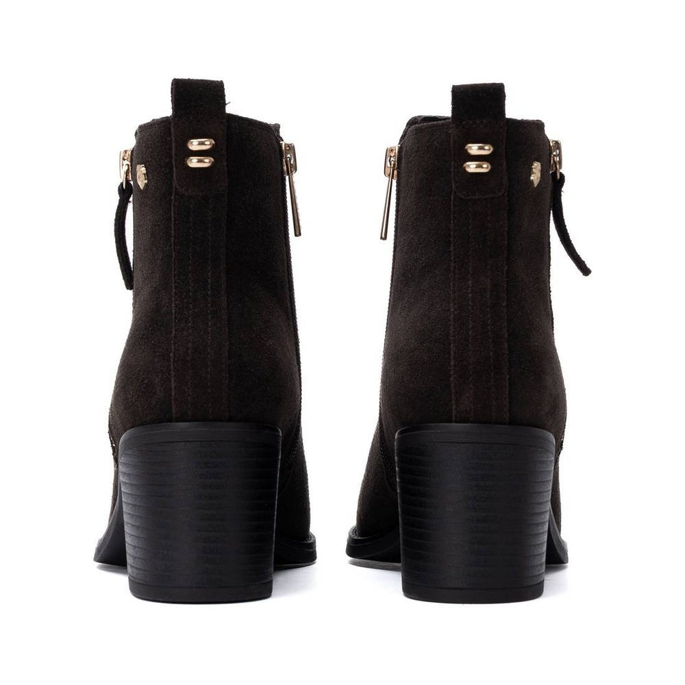 ShoeShop Carmela black suede ankle boots with block heels, side zippers, and pull tabs, rear view.