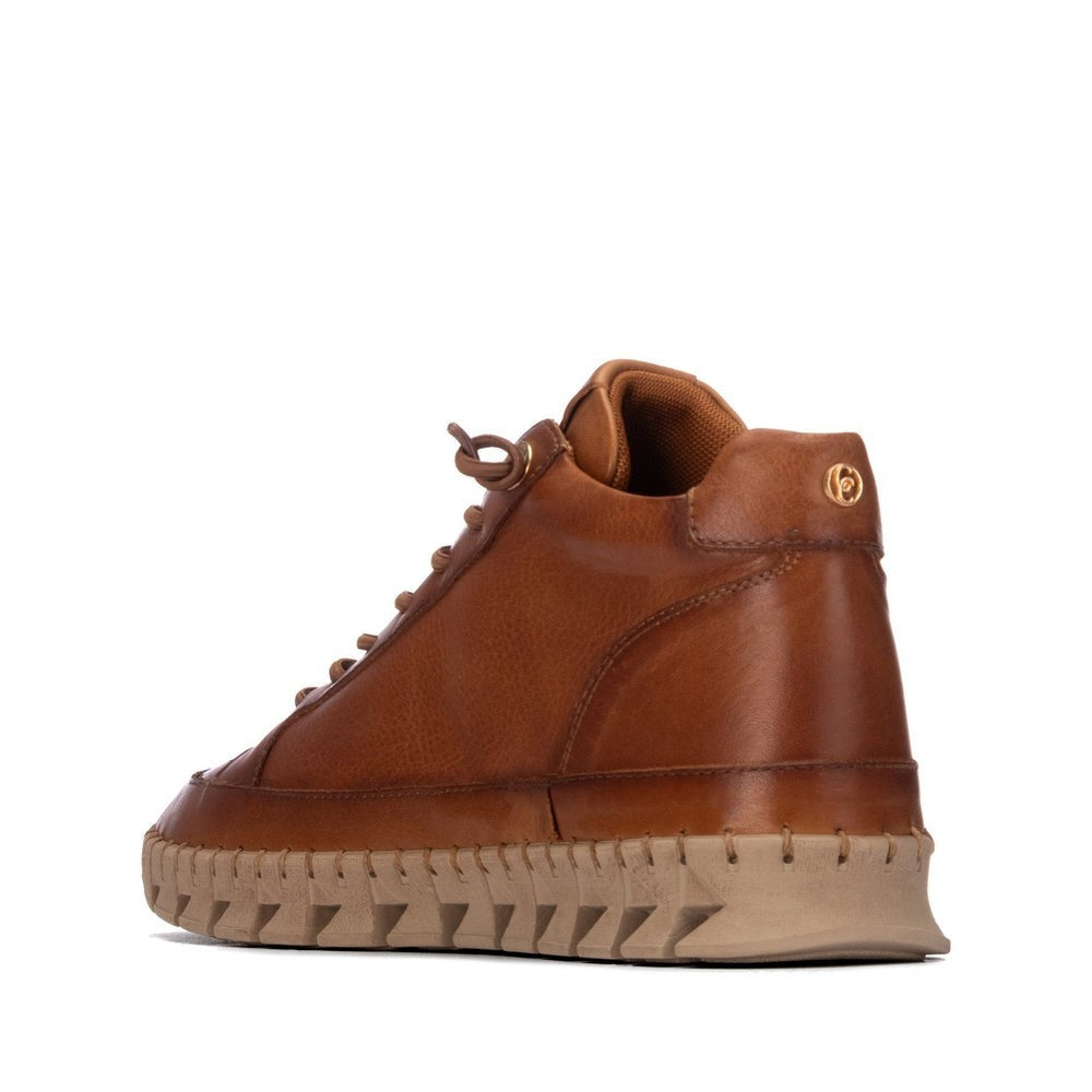 ShoeShop Carmela brown leather ankle boots with lace-up front, side zipper, and chunky beige rubber platform sole.
