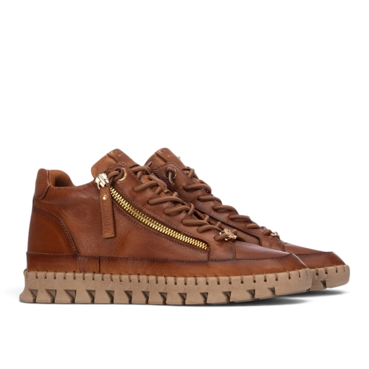 ShoeShop Carmela brown leather ankle boots with side zipper, lace-up front, and chunky serrated rubber sole.