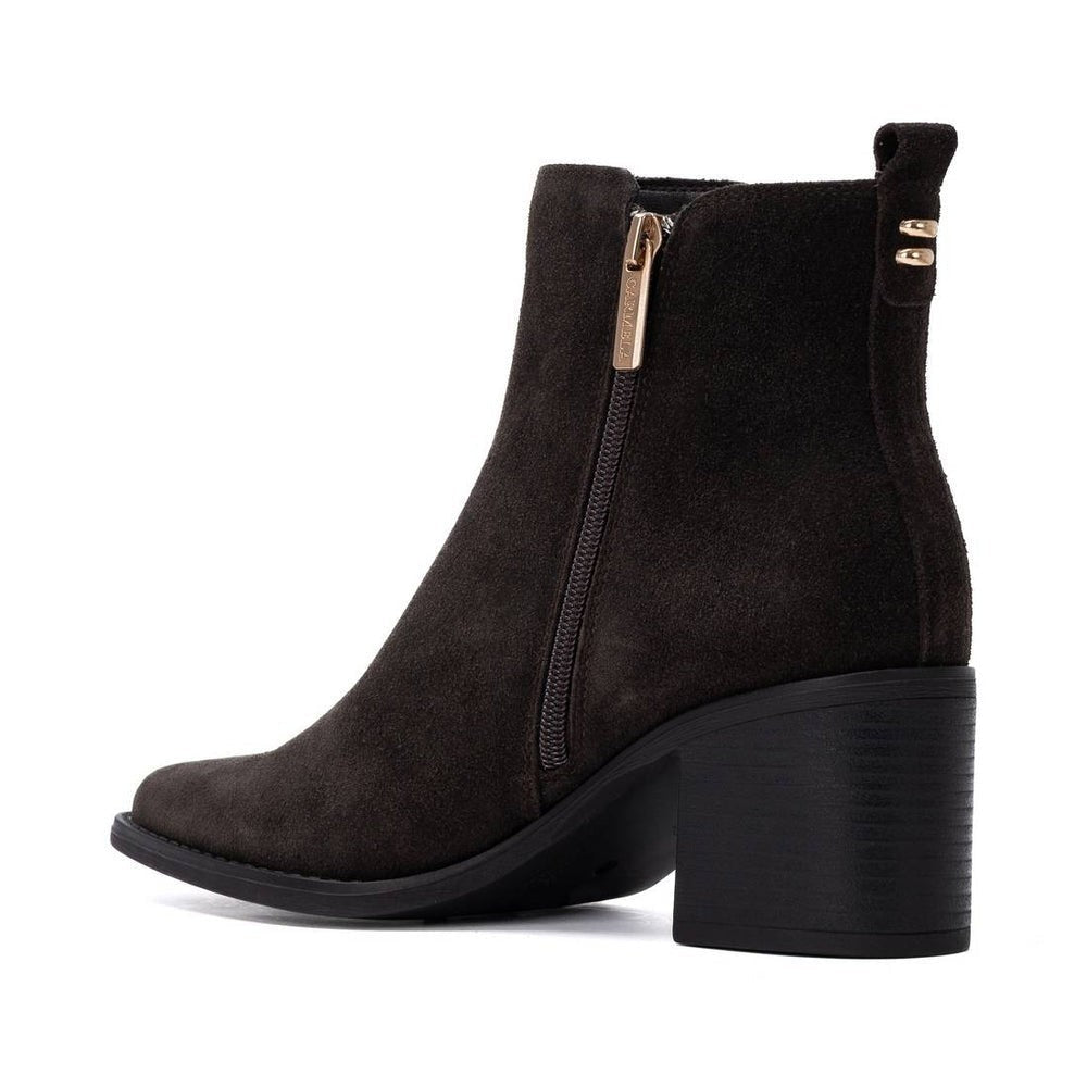 ShoeShop Carmela dark brown suede ankle boots with a side zipper, block heel, and pull tab.