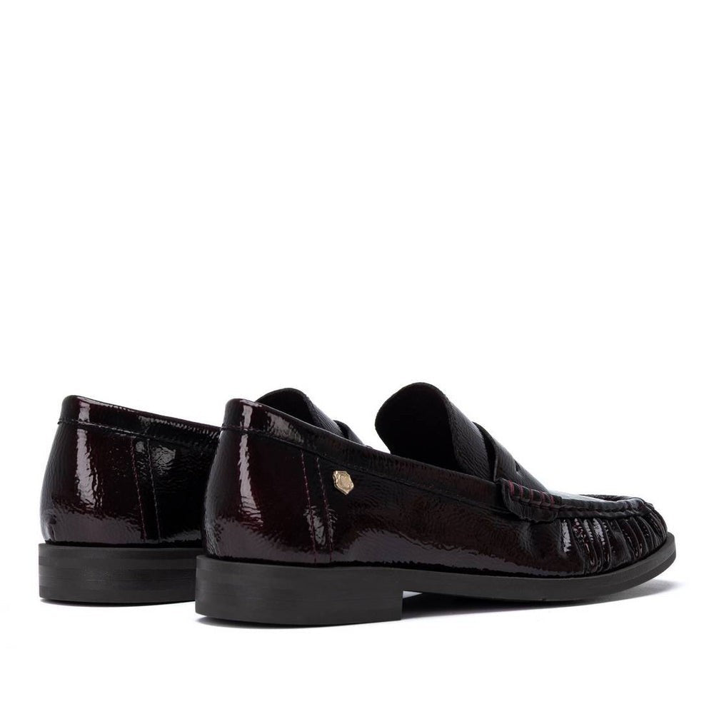 ShoeShop Carmela patent leather loafers in dark burgundy with a decorative front detail and rubber sole