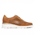 ShoeShop Carmela 163211 tan leather sneakers with perforated side panels, gold accents, and a white platform sole.
