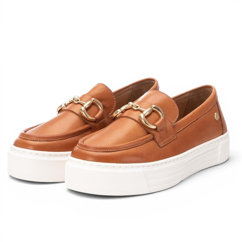 ShoeShop Carmela 161319 tan leather loafers with gold-tone horsebit detail and chunky white platform sole.
