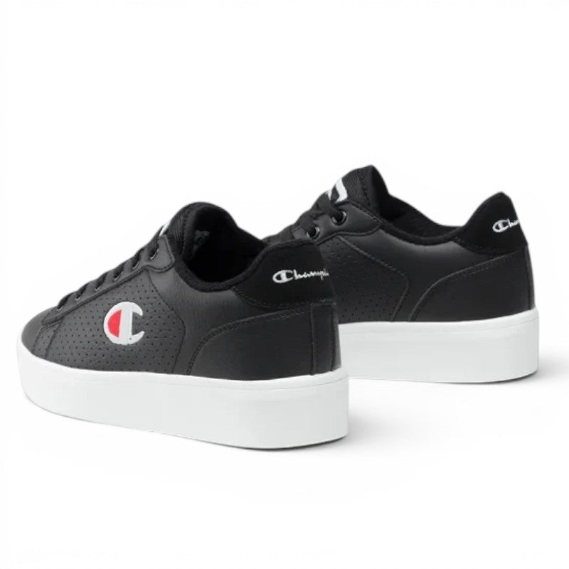 ShoeShop Champion S11177 black low-top sneakers with perforated side panels and white platform soles.