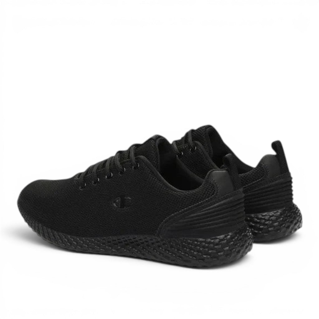 ShoeShop Champion S11496 black athletic sneakers with a textured honeycomb sole and breathable mesh upper.