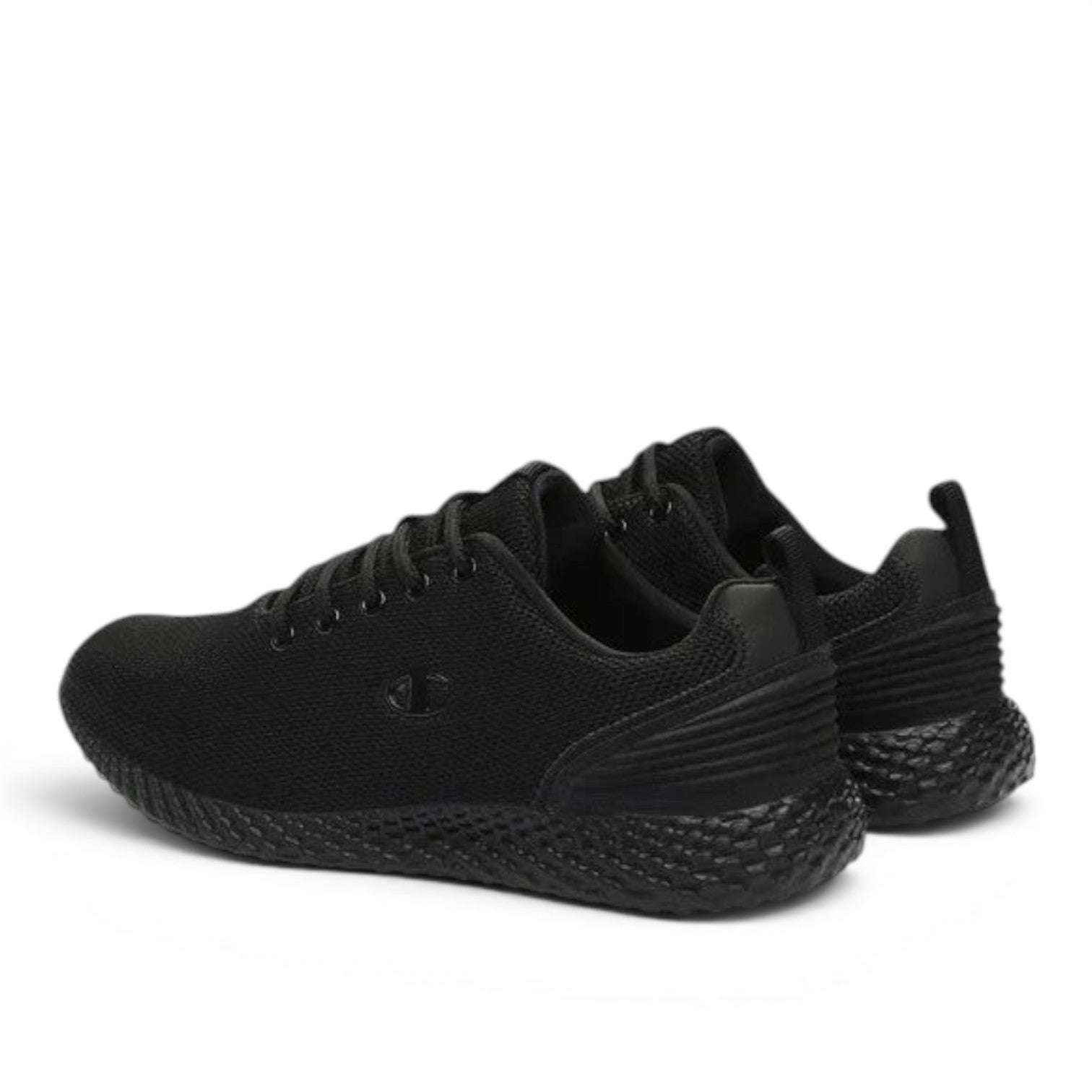 ShoeShop Champion S11496 black athletic sneakers with a textured honeycomb sole and breathable mesh upper.