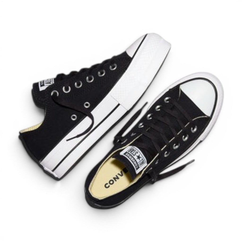 ShoeShop Converse 560250C black canvas low-top sneakers with white platform soles and lace-up closure.