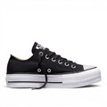 ShoeShop Converse 560250C black canvas low-top platform sneakers with white rubber sole and silver eyelets.