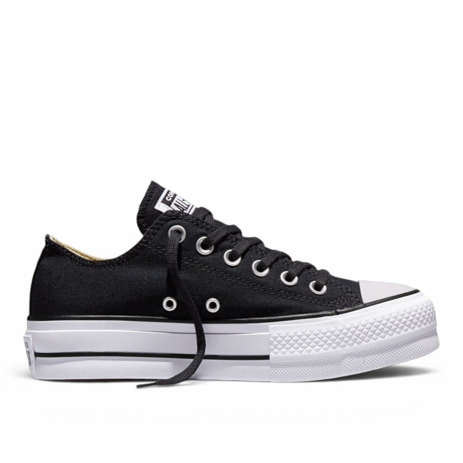 ShoeShop Converse 560250C black canvas low-top platform sneakers with white rubber sole and silver eyelets.