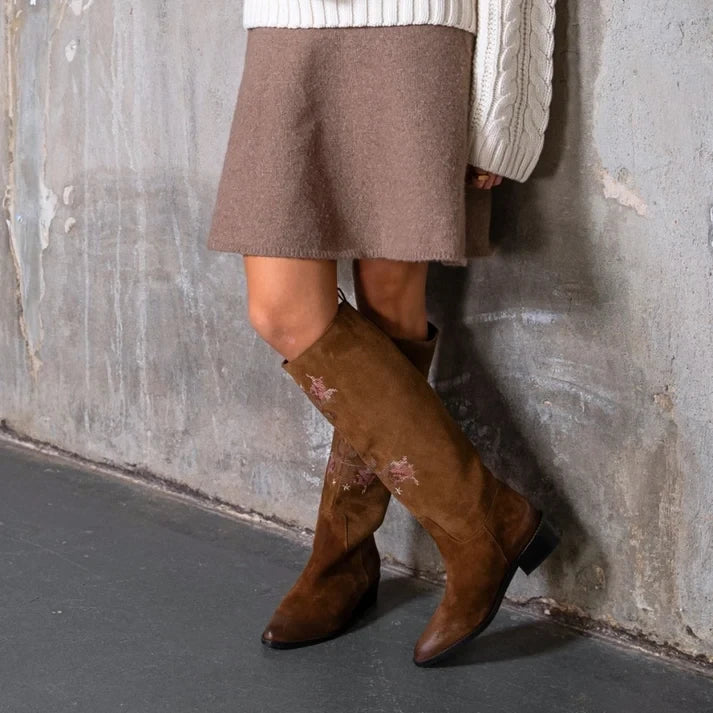 ShoeShop Copenhagen CS9068 brown suede knee-high boots with floral embroidery worn with a beige skirt and sweater