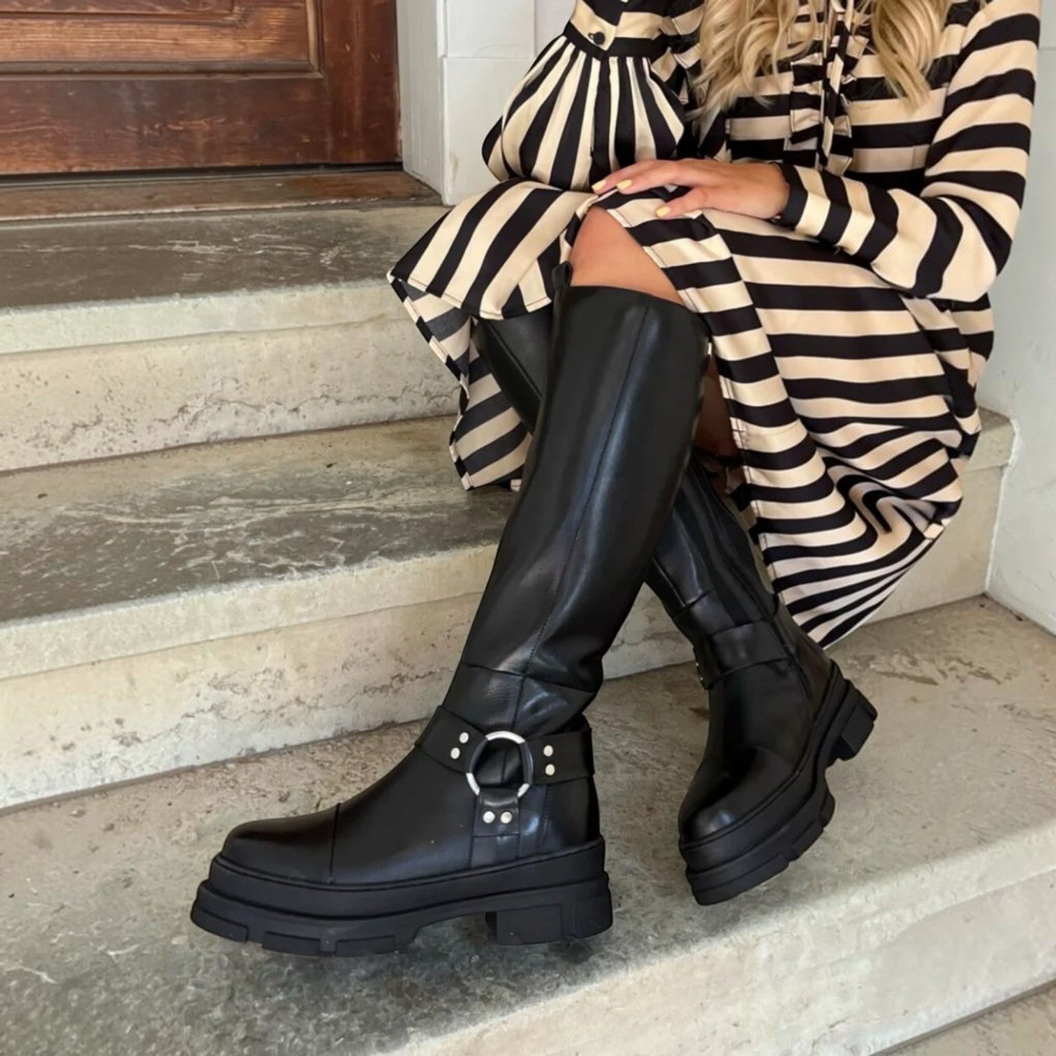 ShoeShop Copenhagen CS8156 black leather knee-high boots with chunky lug soles and silver ring harness detail.