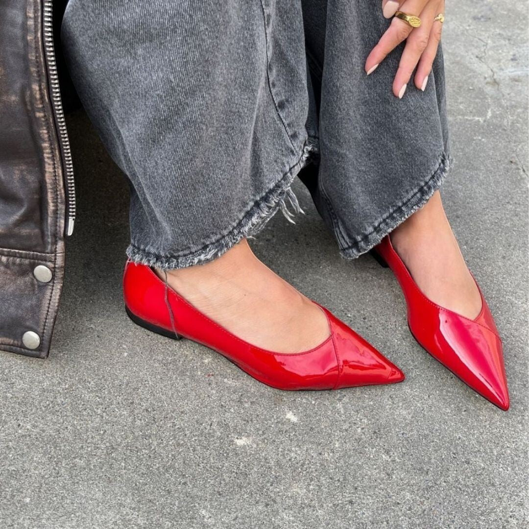 ShoeShop Copenhagen CS8334 red patent leather pointed-toe flats worn with grey jeans and a leather jacket