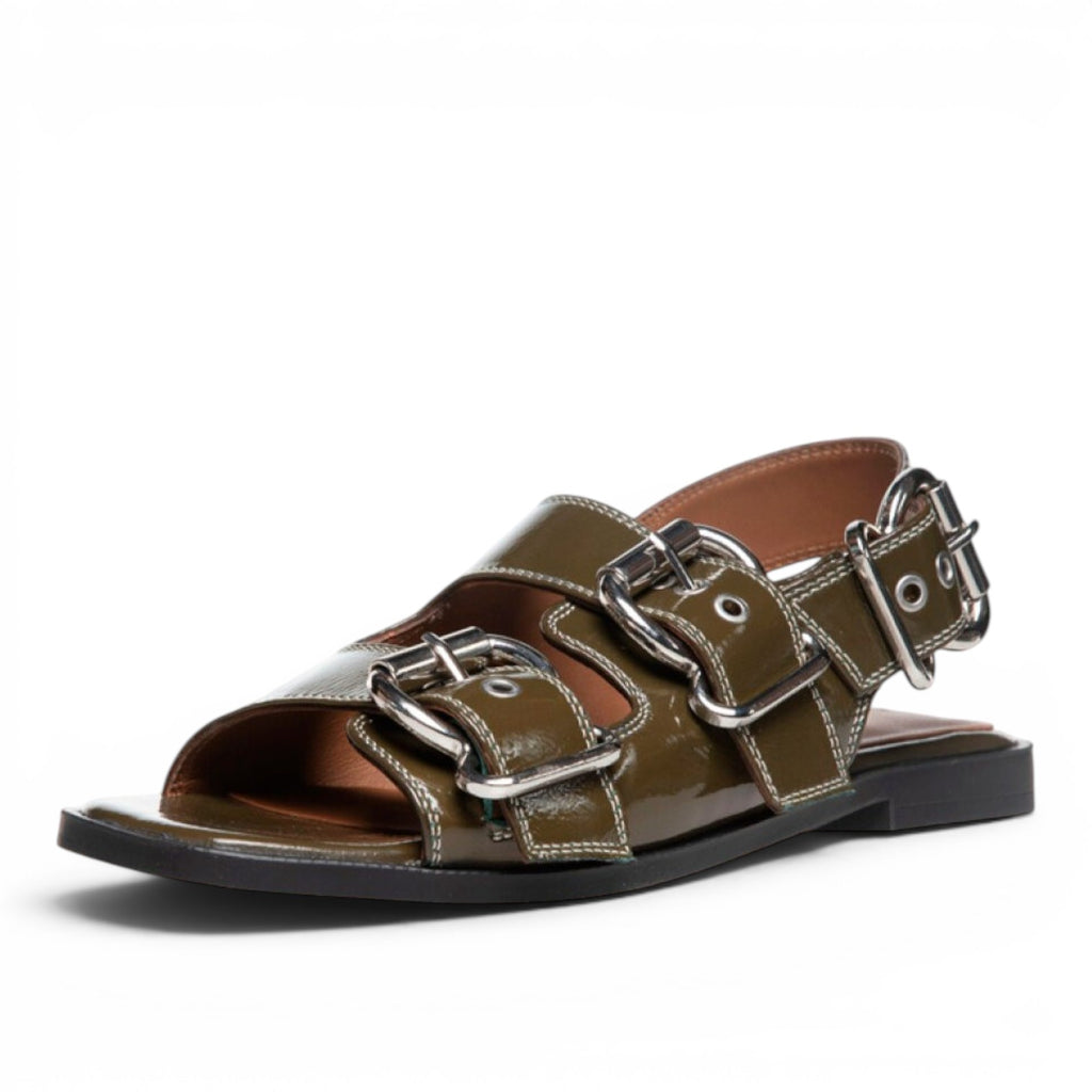 ShoeShop Copenhagen CS8461 olive green patent leather flat sandals with chunky silver buckles and contrast stitching.
