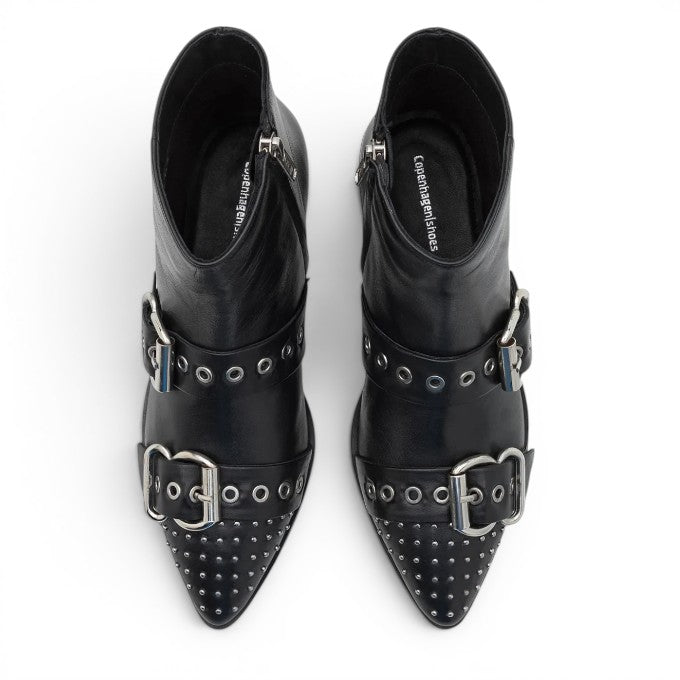 ShoeShop Copenhagen CS8602 black leather ankle boots with silver buckles, metal studs, and a pointed toe design.
