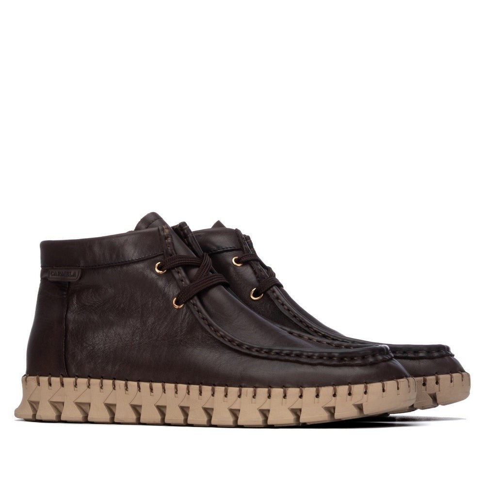 ShoeShop dark brown leather ankle boots with a distinctive beige serrated platform sole and lace-up closure