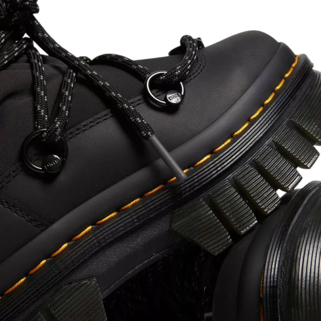 ShoeShop Dr. Martens Audrick Hi Puffer black leather and textile boot with yellow welt stitching and lugged sole