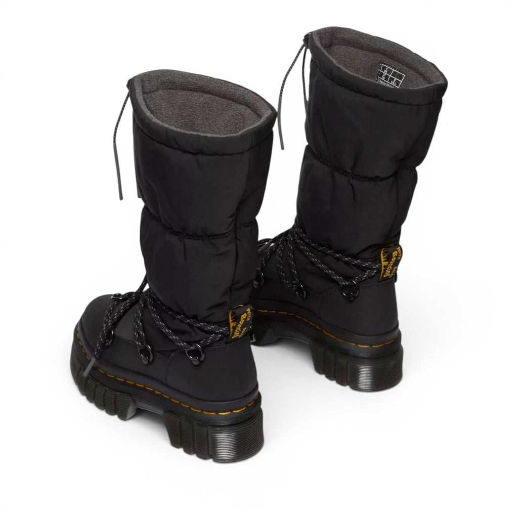 ShoeShop Dr. Martens Audrick Hi Puffer boots in black with fleece lining, chunky platform sole, and lace-up detail.