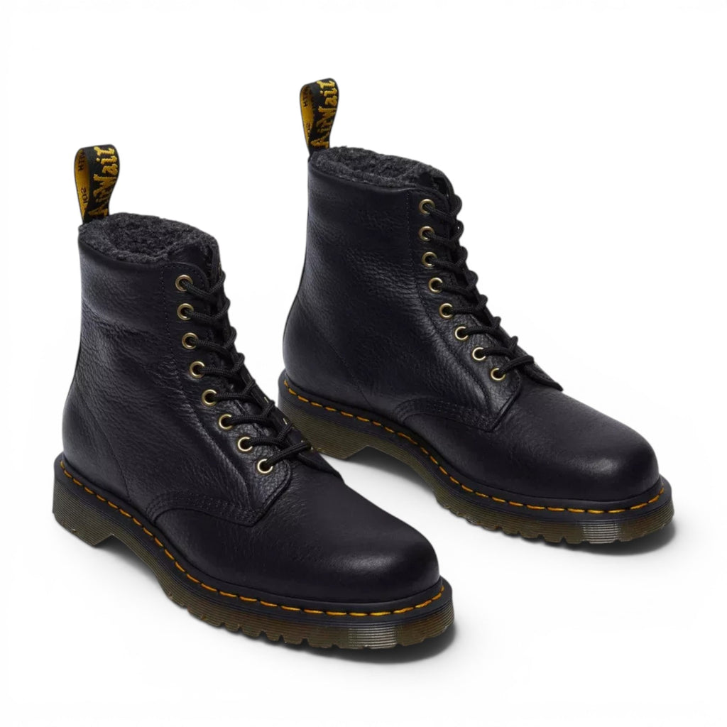 ShoeShop Dr. Martens 1460 black grizzly leather boots with warm faux fur lining and signature yellow stitching.