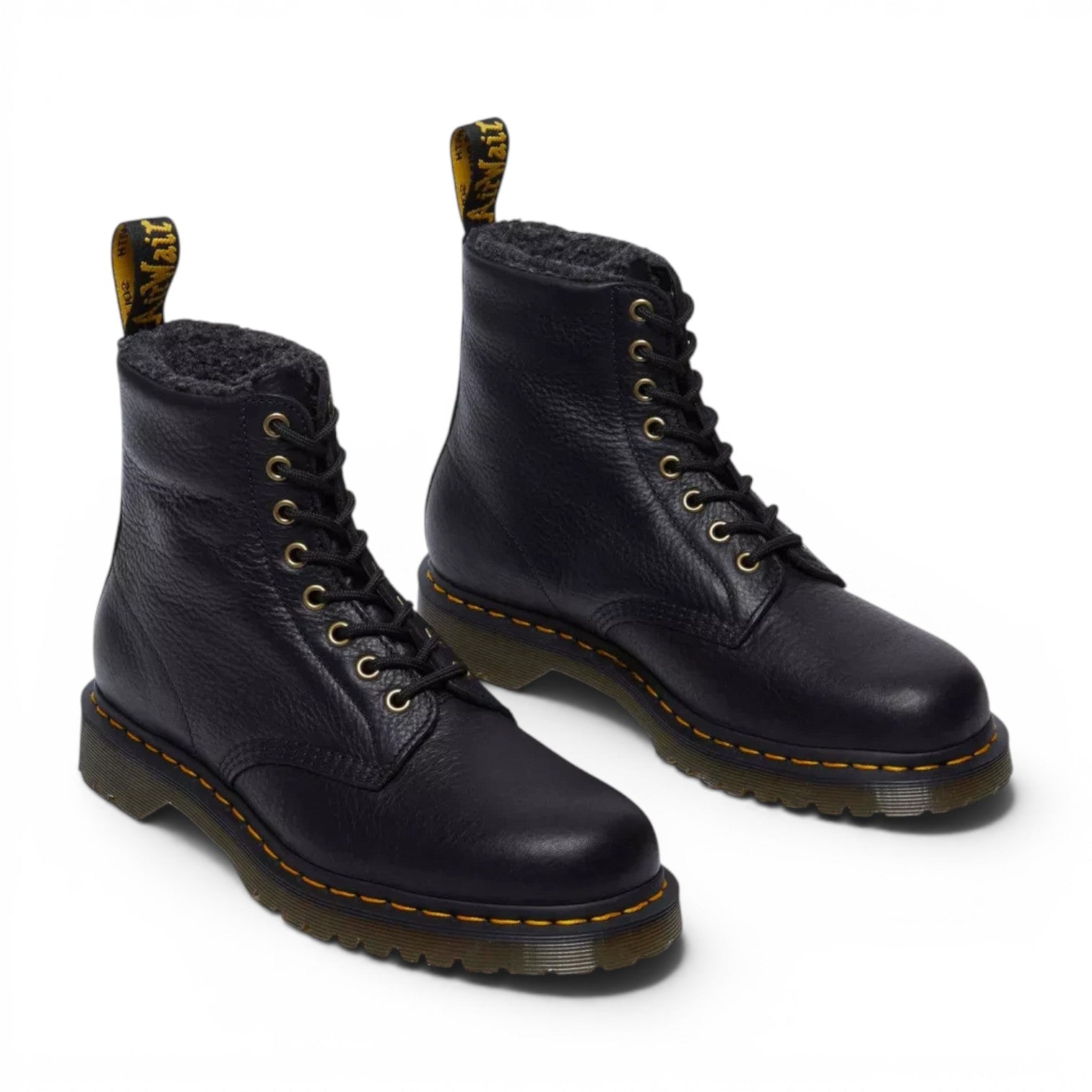 ShoeShop Dr. Martens 1460 black grizzly leather boots with warm faux fur lining and signature yellow stitching.