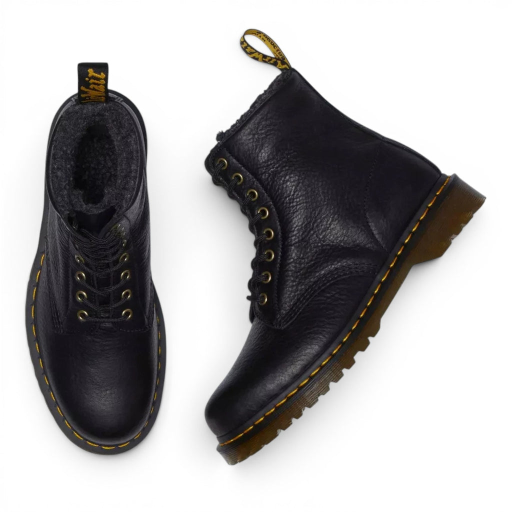 ShoeShop Dr. Martens 1460 black grizzly leather boots with warm faux fur lining and signature yellow stitching.