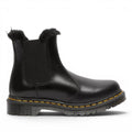 ShoeShop Dr. Martens black leather Chelsea boots with faux fur lining and signature yellow welt stitching