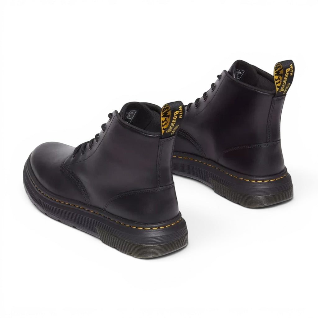 ShoeShop Dr. Martens 31672001 black leather ankle boots with yellow stitching and iconic heel pull tabs