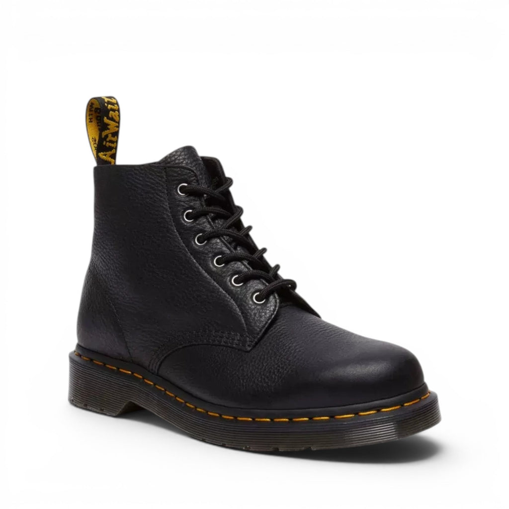 ShoeShop Dr. Martens 101 Ambassador black leather ankle boots with yellow stitching and signature heel loop.