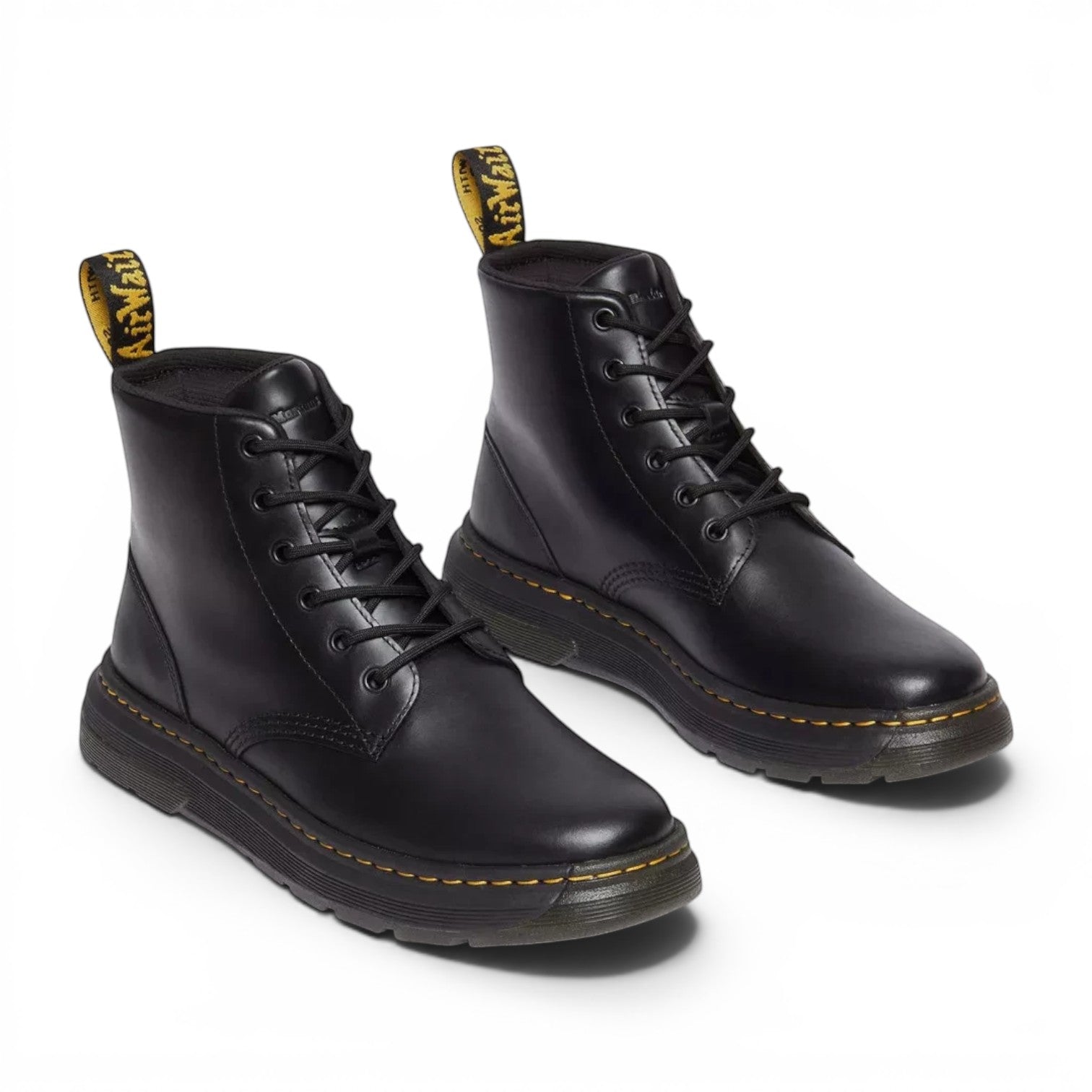 ShoeShop Dr. Martens black leather ankle boots with lace-up closure and signature yellow stitching