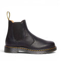 ShoeShop Dr. Martens 2976 Ambassador black soft leather Chelsea boots with yellow stitching and elastic side panels.