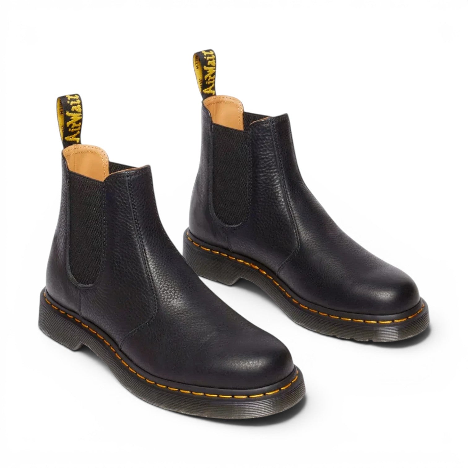 ShoeShop Dr. Martens 2976 Ambassador black soft leather Chelsea boots with yellow welt stitching and pull tabs.