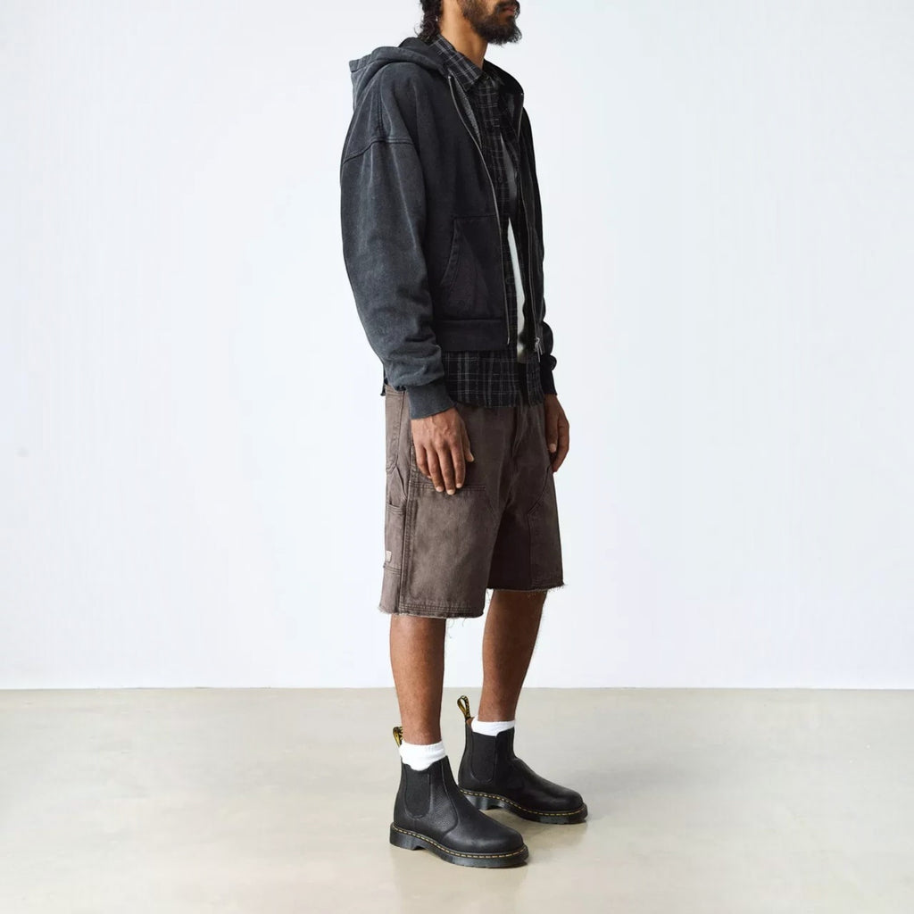 ShoeShop Dr. Martens 2976 Ambassador soft black leather Chelsea boots worn by a man in casual streetwear