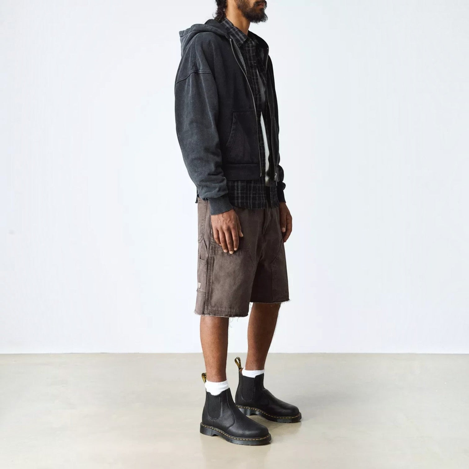ShoeShop Dr. Martens 2976 Ambassador soft black leather Chelsea boots worn by a man in casual streetwear
