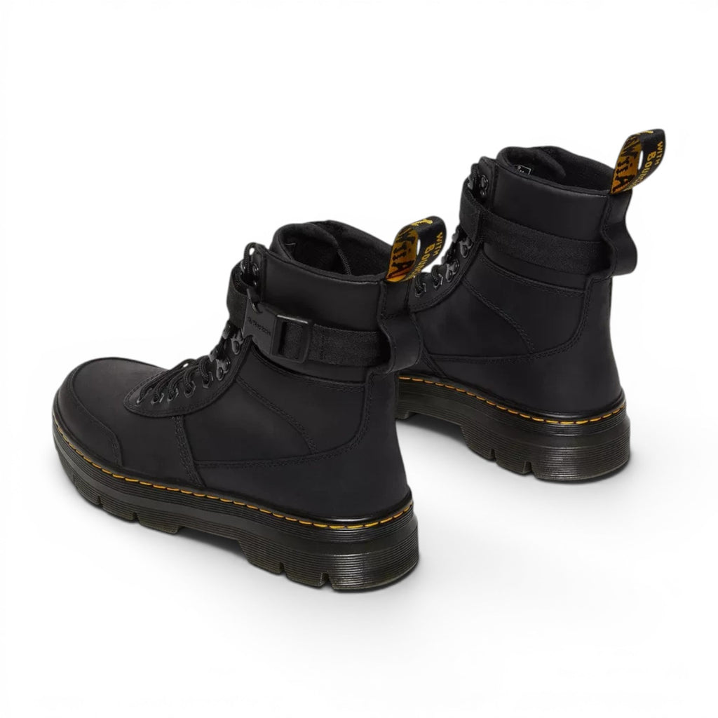 ShoeShop Dr. Martens Combs Tech II black Wyoming leather utility boots with yellow stitching and ankle strap
