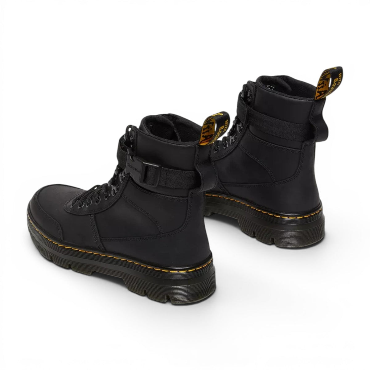 ShoeShop Dr. Martens Combs Tech II black Wyoming leather utility boots with yellow stitching and ankle strap