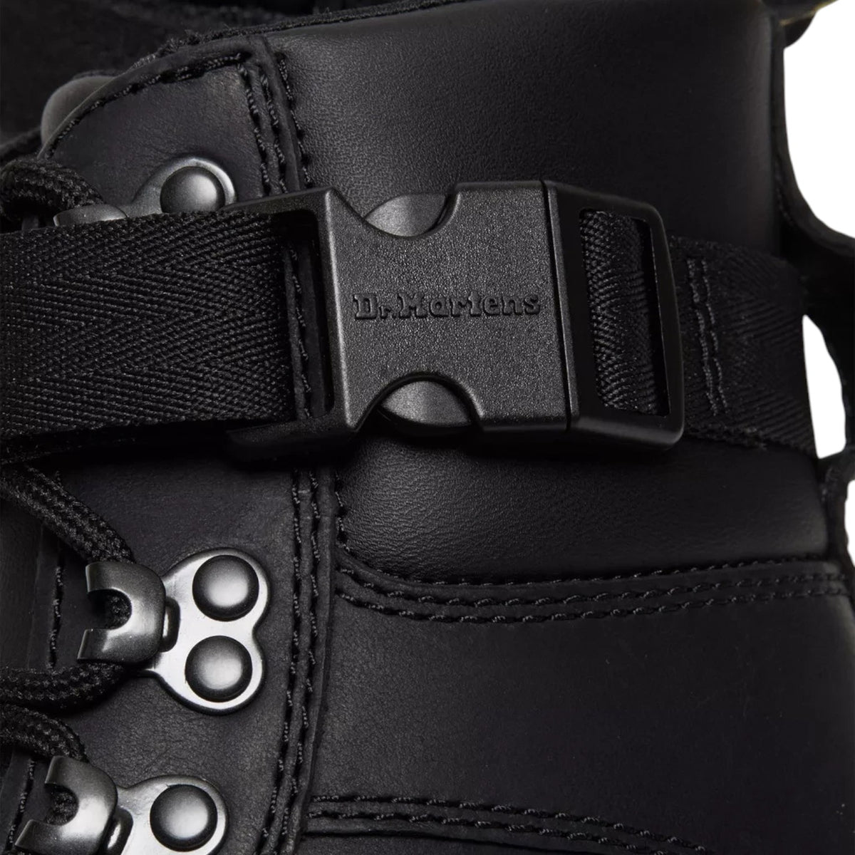 ShoeShop Dr. Martens Combs Tech II black Wyoming leather utility boot with buckle strap and metal eyelets