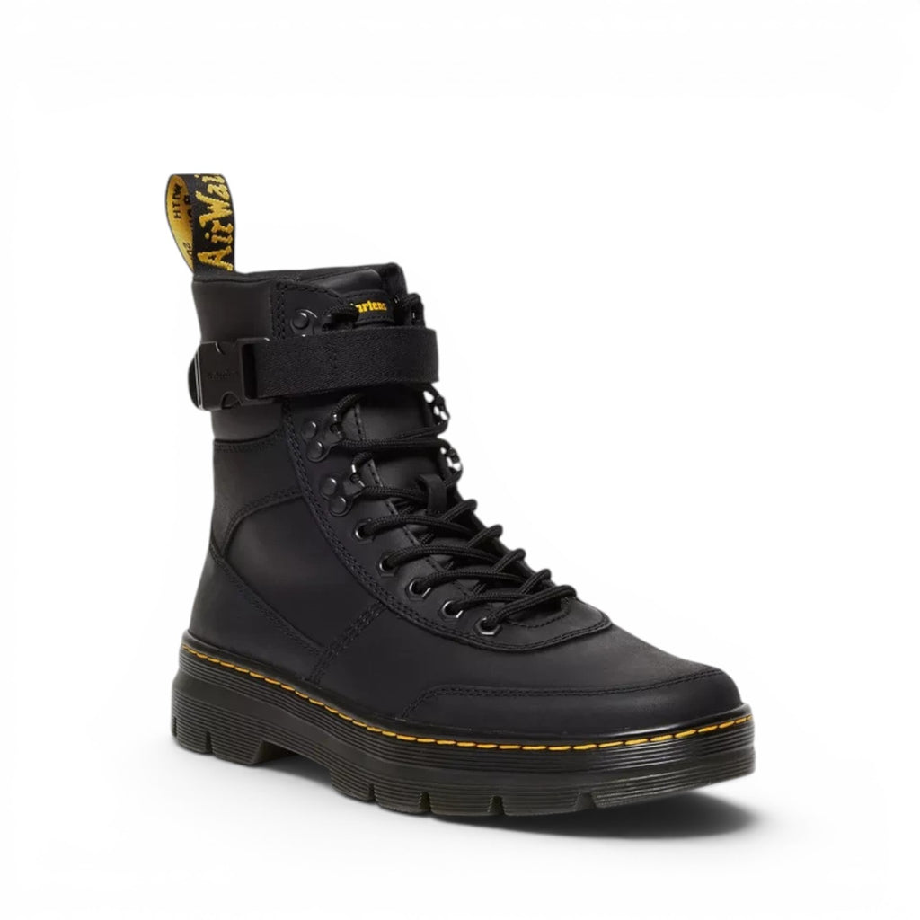 ShoeShop Dr. Martens Combs Tech II black Wyoming leather utility boots with buckle strap and yellow welt stitching