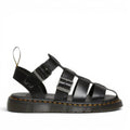 ShoeShop Dr. Martens Garin Brando black leather gladiator sandals with adjustable buckle straps and signature yellow stitching.