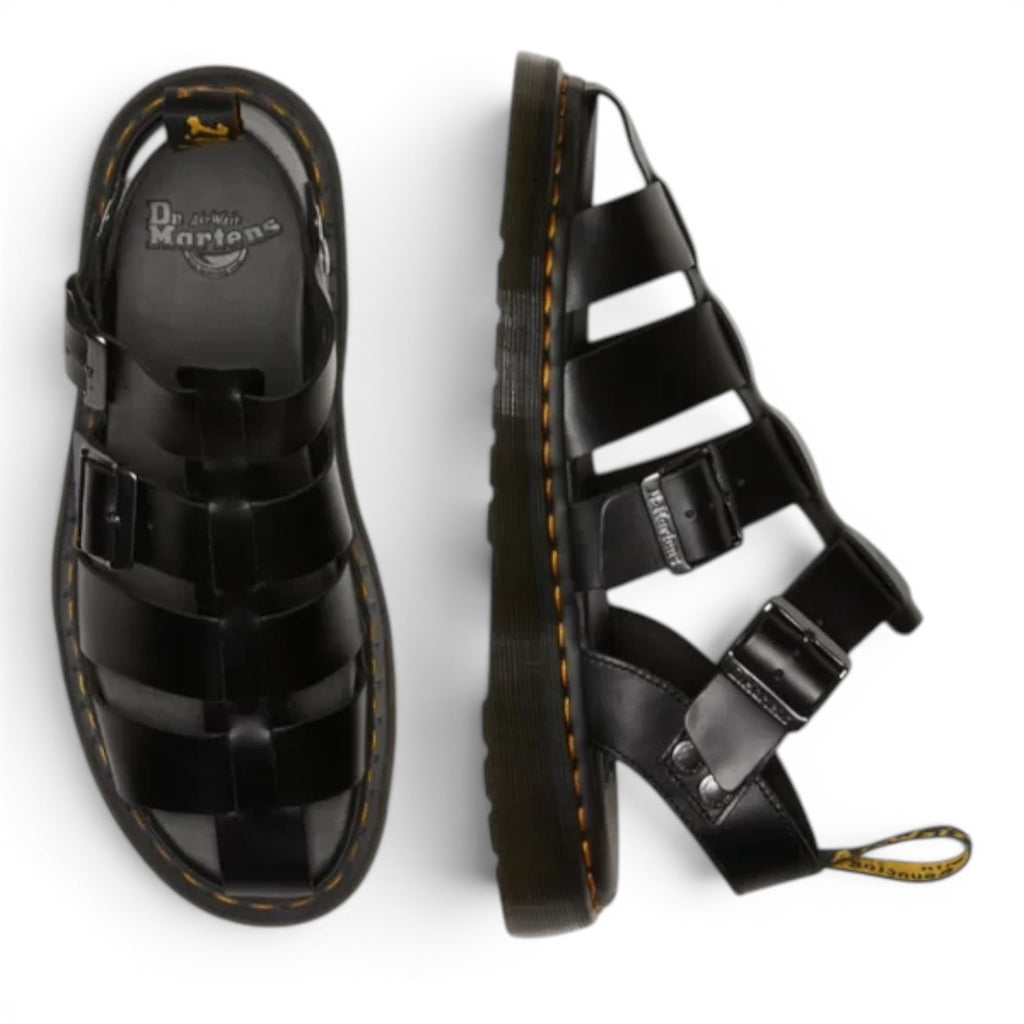 ShoeShop Dr. Martens Garin Brando black leather gladiator sandals with adjustable buckles and signature yellow stitching