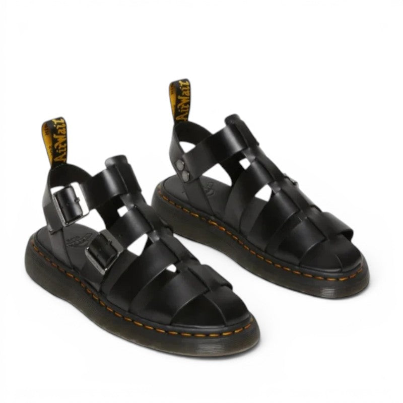 ShoeShop Dr. Martens Garin Brando black leather gladiator sandals with buckle straps and signature yellow stitching.