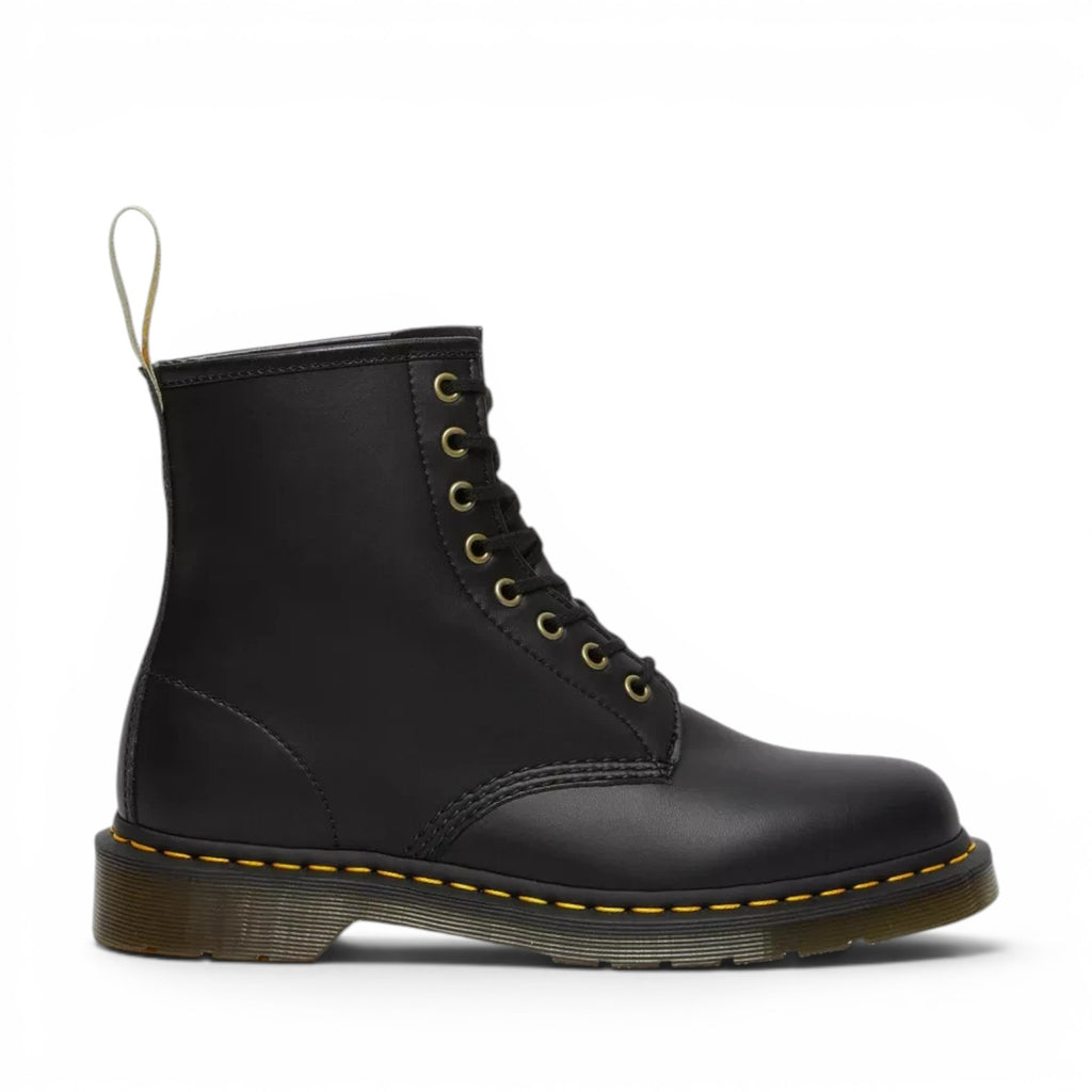 ShoeShop Dr. Martens 1460 Felix vegan black leather lace-up boots with yellow stitching and gold eyelets.