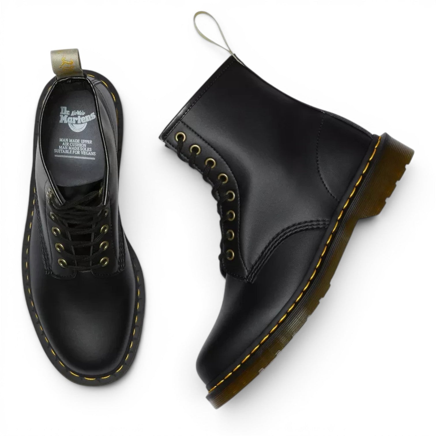 ShoeShop Dr. Martens 1460 Felix vegan black lace-up boots with yellow stitching and gold eyelets.