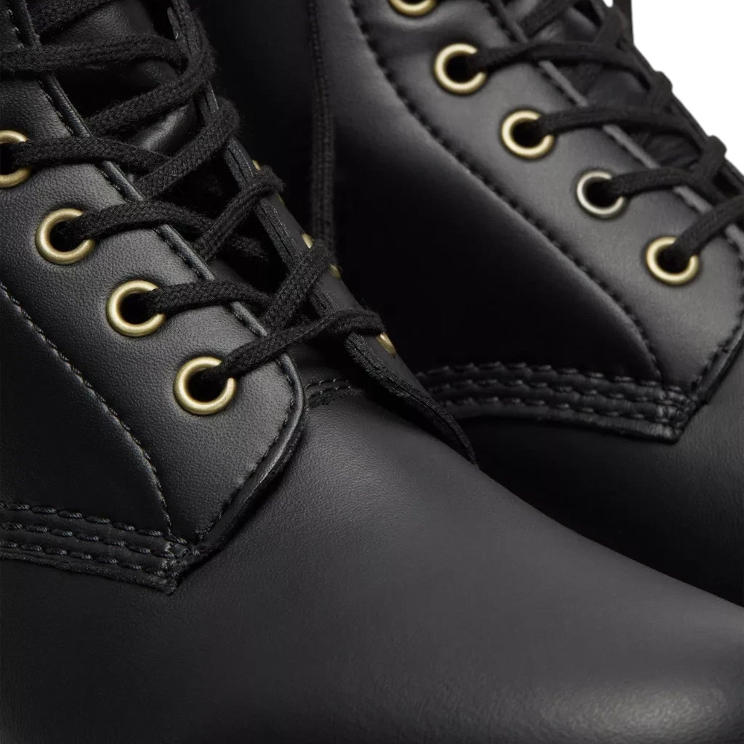 ShoeShop Dr. Martens Vegan 1460 Felix black lace-up boots featuring gold eyelets and smooth synthetic material.