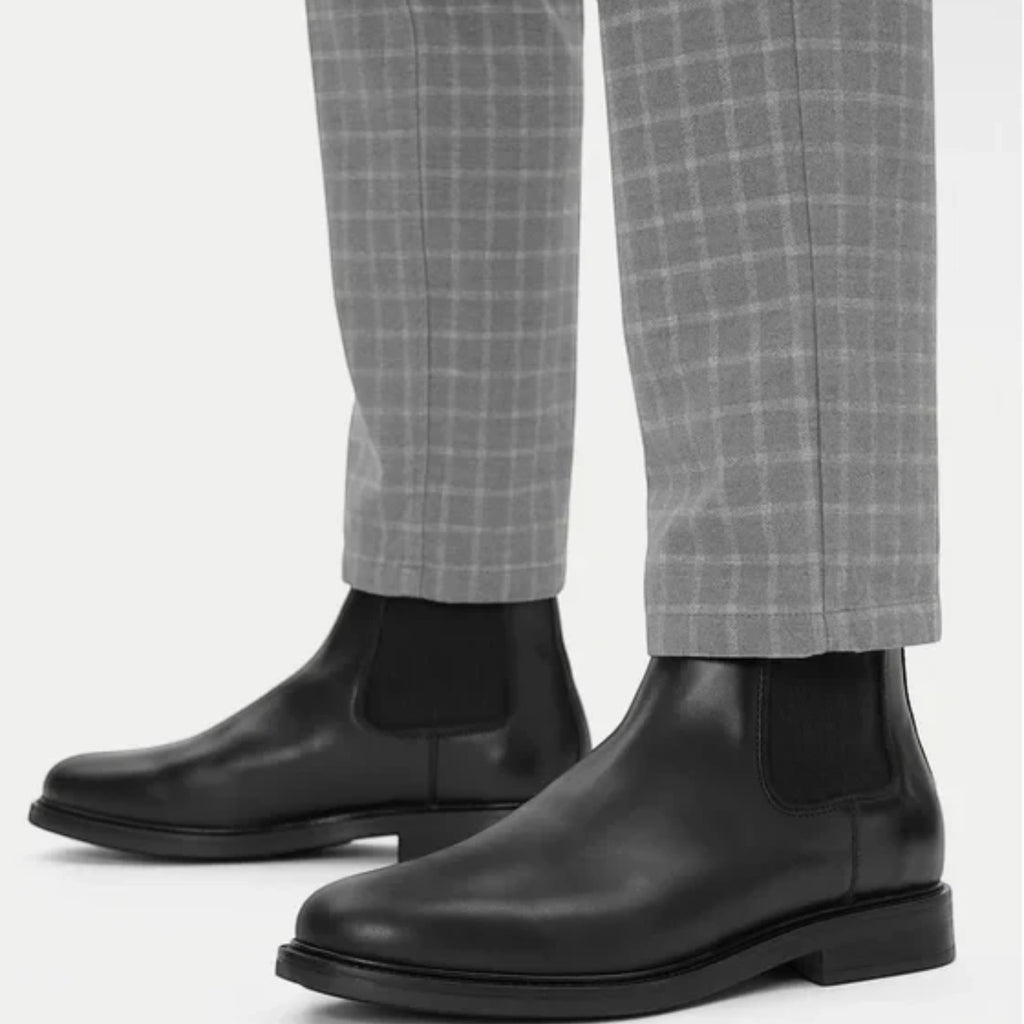 ShoeShop GANT black leather Chelsea boots with elastic side panels worn with grey checkered trousers