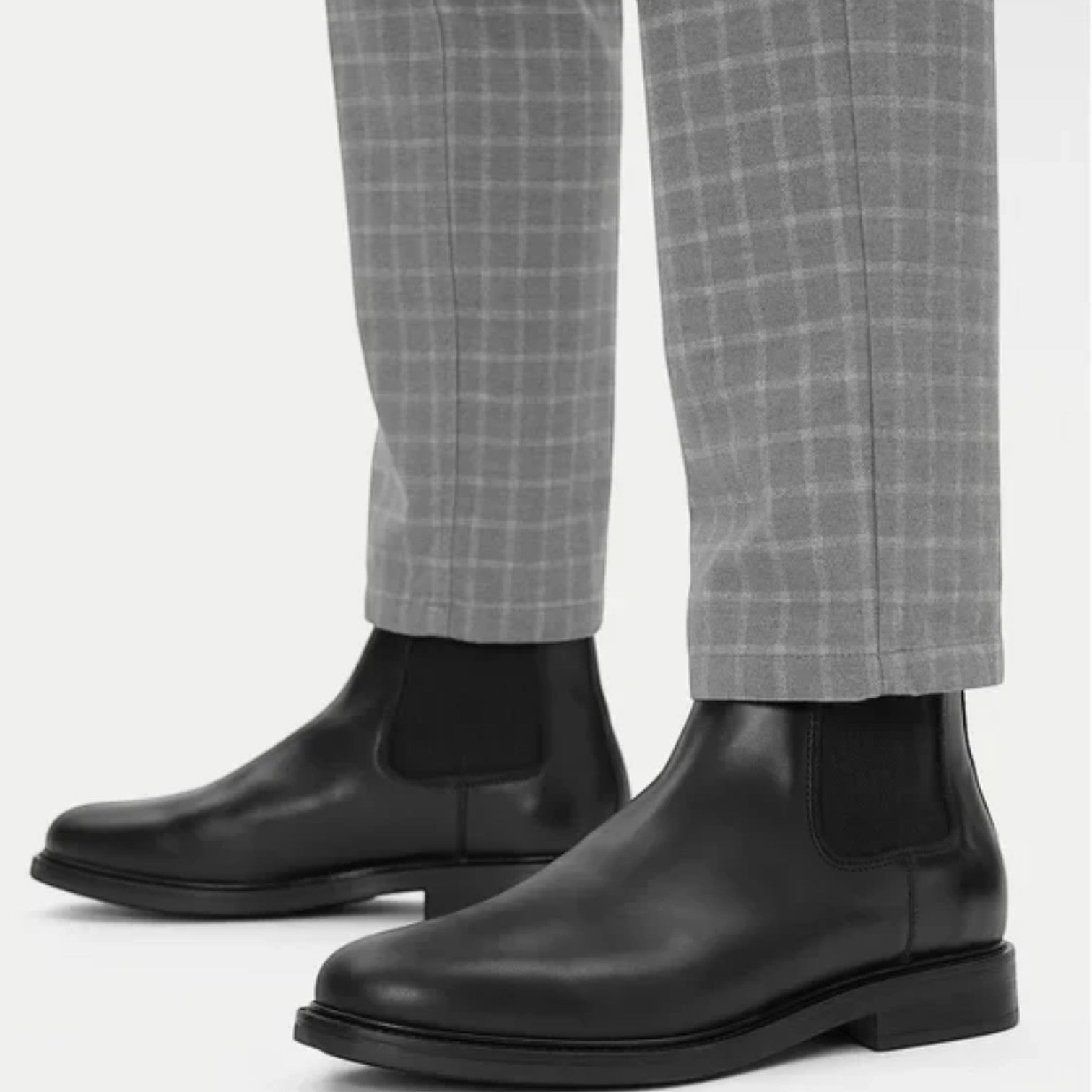 ShoeShop GANT black leather Chelsea boots with elastic side panels worn with grey checkered trousers