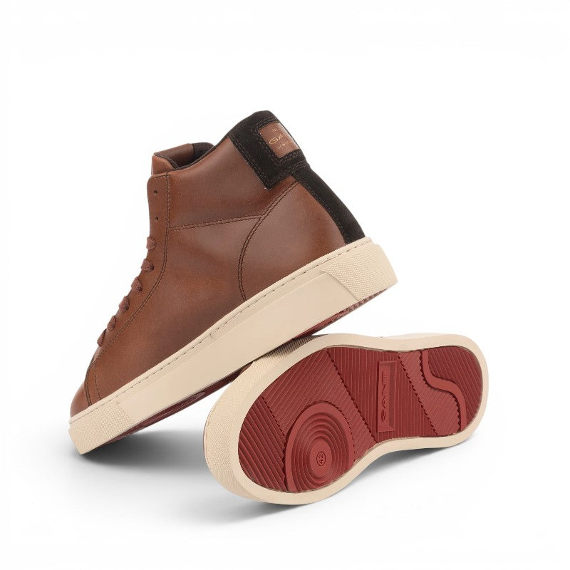 ShoeShop GANT brown leather high-top sneakers with a cream rubber sole and red tread detail.