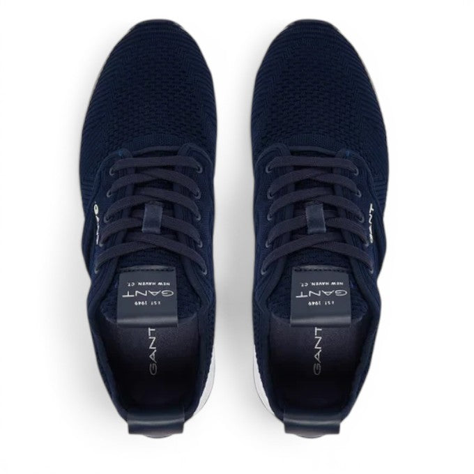ShoeShop GANT navy blue knit sneakers with lace-up closure and branded tongue label, top-down view.