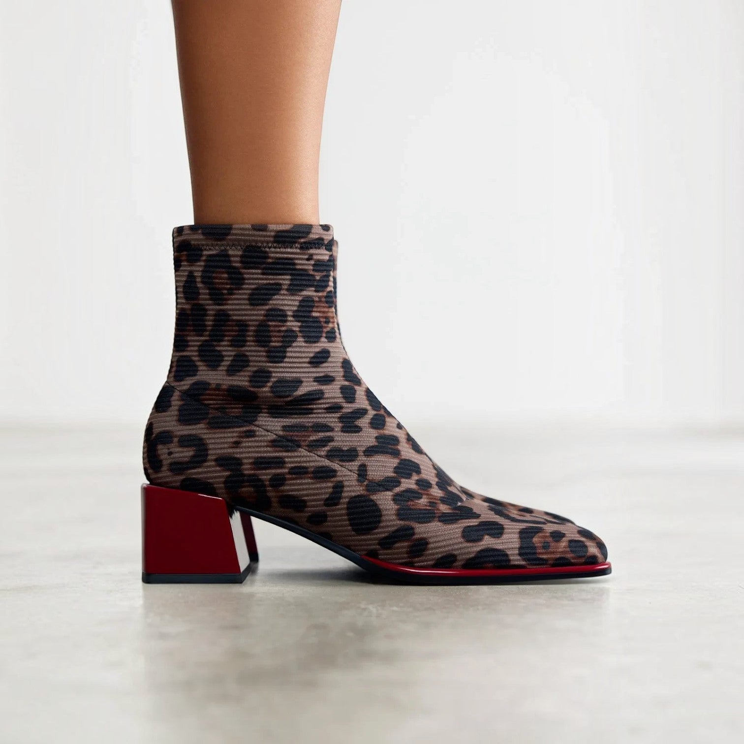ShoeShop Gioseppo 80683 ankle boots featuring a brown and black leopard print knit fabric and a bold red block heel.